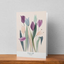 Load image into Gallery viewer, A greeting card featuring a tulip illustration stood up against a pale background. The text on the illustration reads tulip tulipa
